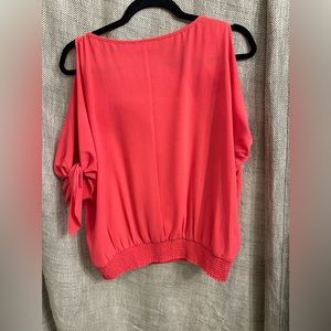 Like new coral top with cut out shoulders. Worn once,  wrinkle proof.